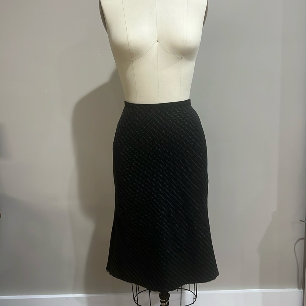 Black skirt with design. Flows in back.